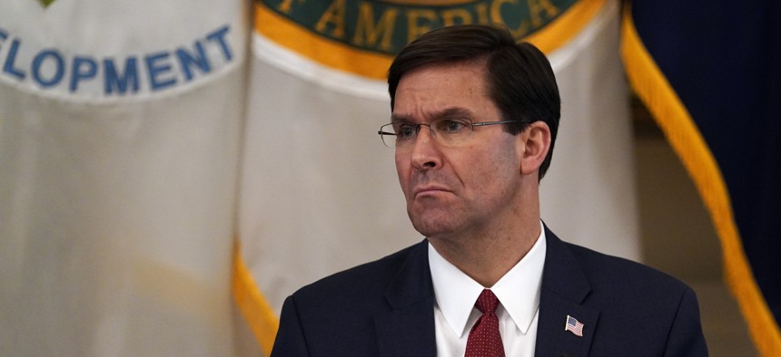 Defense Secretary Mark Esper listens as President Donald Trump speaks during a Cabinet Meeting in the East Room of the White House, Tuesday, May 19, 2020, in Washington.