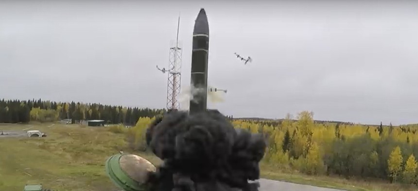 In this photo taken from undated footage distributed by Russian Defense Ministry Press Service, an intercontinental ballistic missile lifts off from a silo somewhere in Russia.