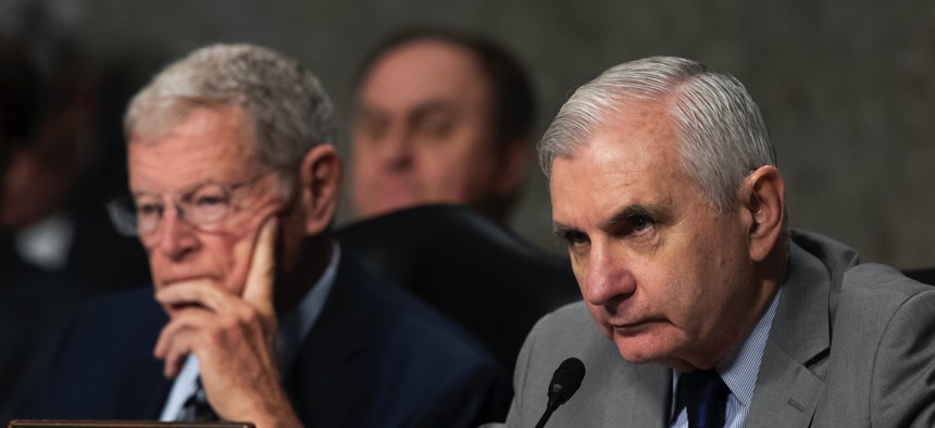 Senate Armed Services Committee Chairman Jim Inhofe, of Oklahoma, listens as Ranking Member Sen. Jack Reed, D-R.I., speaks during a hearing of the Senate Armed Services Committee on Dec. 3, 2019 in Washington.