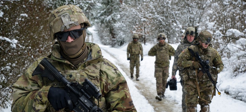 Army Spc. Paul Norris leads a group of soldiers conducting scouting operations at the Grafenwoehr Training Area, Germany, Feb. 28, 2020.
