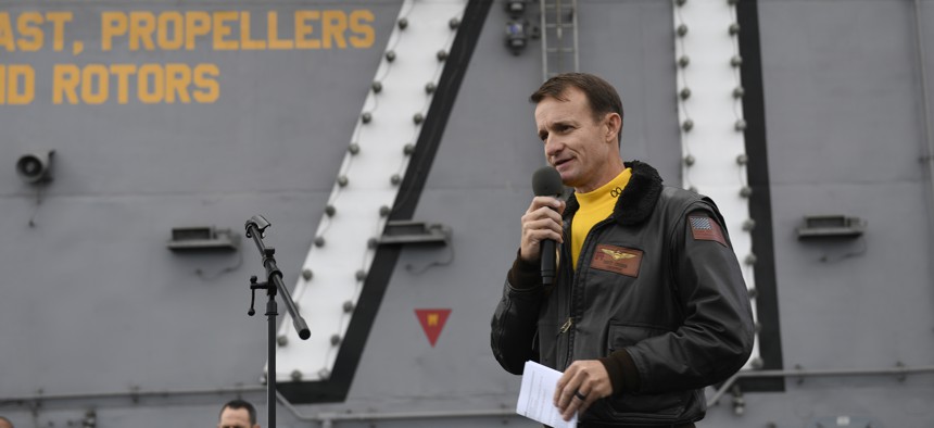 In this Nov. 15, 2019, photo U.S. Navy Capt. Brett Crozier, commanding officer of the aircraft carrier USS Theodore Roosevelt (CVN 71), addresses the crew