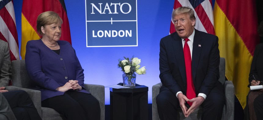 President Donald Trump speaks during a meeting with German Chancellor Angela Merkel during the NATO summit at The Grove, Wednesday, Dec. 4, 2019, in Watford, England. President Donald Trump is calling Canadian Prime Minister Justin Trudeau “two-faced” aft