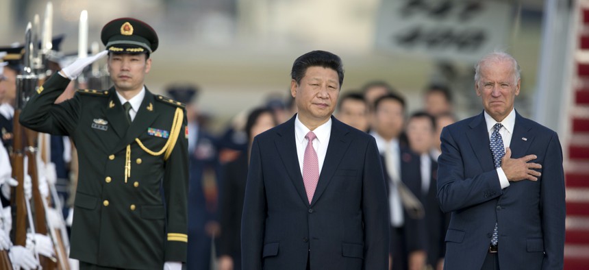 Chinese President Xi Jinping, and Vice President Joe Biden stand for the National Anthem during an arrival ceremony in Andrews Air Force Base, Md., on, Sept. 24, 2015.