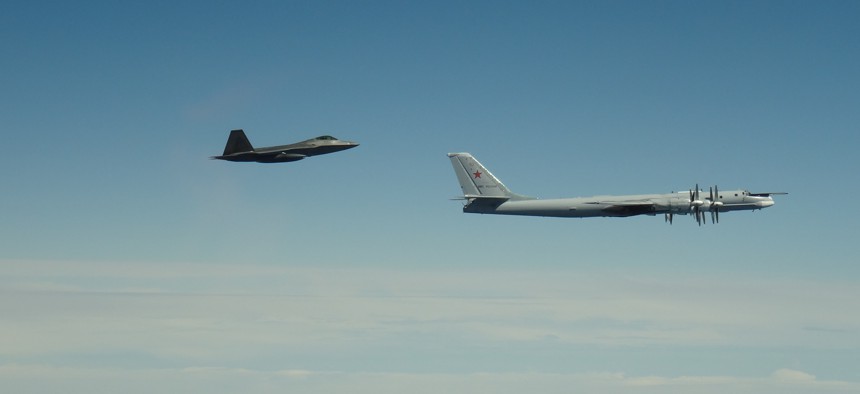 An F-22 Raptor assigned to Joint Base Elmendorf-Richardson, in Alaska, intercepts a Russian Tu-95 Bear on June 9, 2020.