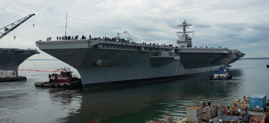 Tugs direct USS Gerald R. Ford (CVN 78) as it gets underway. Ford departed Huntington Ingalls Industries-Newport News Shipbuilding, Va., on Oct. 25, 2019.