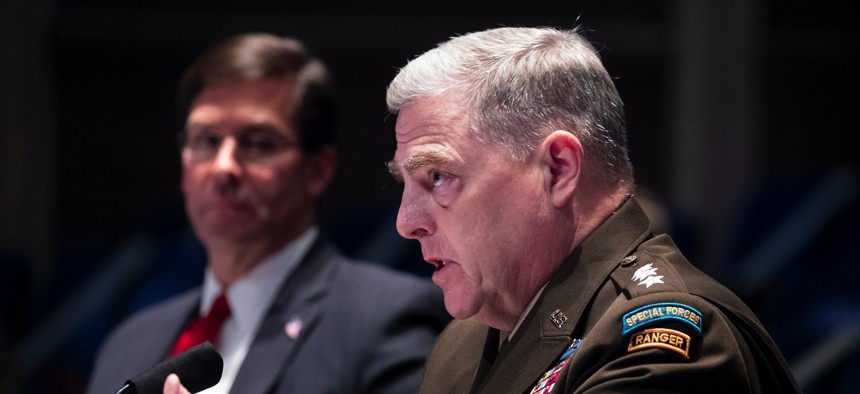 Defense Secretary Mark Esper, left, listens as Chairman of the Joint Chiefs of Staff Gen. Mark Milley testifies during a House Armed Services Committee hearing on Thursday, July 9, 2020, on Capitol Hill in Washington.