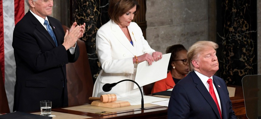 House Speaker Nancy Pelosi, D-Calif., tears her copy of President Donald Trump's s State of the Union address after he delivered it to a joint session of Congress on Capitol Hill in Washington, on Tuesday, Feb. 4, 2020. Vice President Mike Pence applauds 