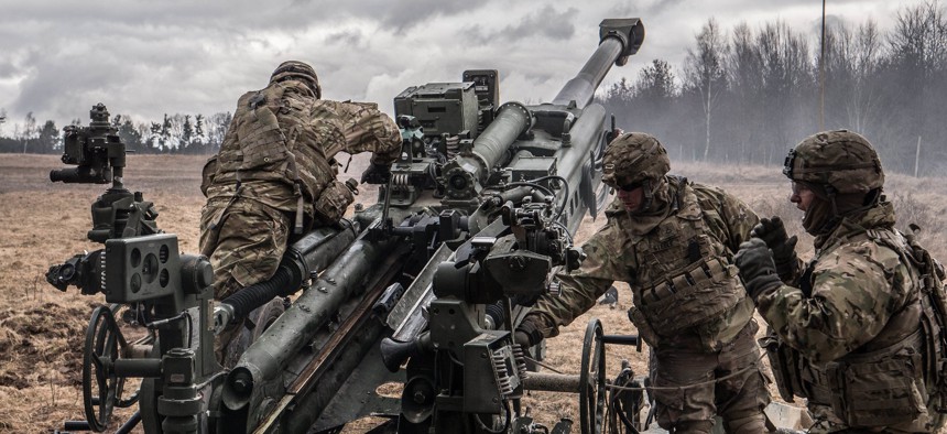 U.S. soldiers prepare to fire Howitzer during exercise Dynamic Front at Grafenwoehr military base, Germany on March 7, 2018.