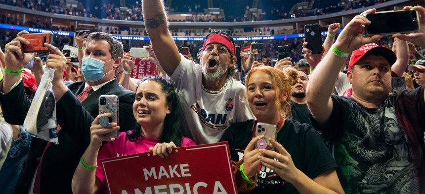 Supporters of President Donald Trump cheer as he arrives on stage to speak to a campaign rally at the BOK Center, Saturday, June 20, 2020, in Tulsa, Okla.
