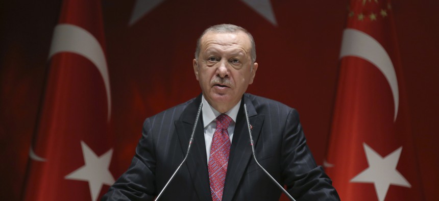 President Recep Tayyip Erdogan addresses his party members, in Ankara, Turkey, Thursday, Aug. 13, 2020.