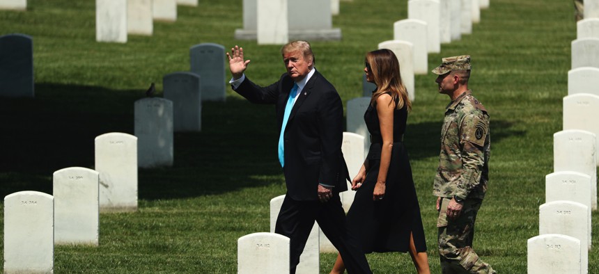President Donald Trump and first lady Melania Trump visit Arlington National Cemetery for the annual Flags In ceremony ahead of Memorial Day Thursday, May 23, 2019, in Arlington, Va.