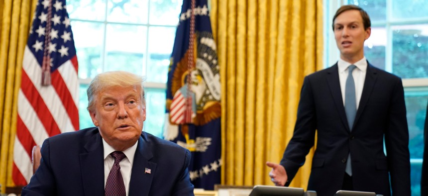 President Donald Trump listens as Jared Kushner speaks in the Oval Office of the White House on Friday, Sept. 11, 2020.