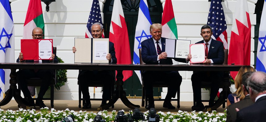 Leaders display a signed agreement at the White House on Sept. 15, 2020. 