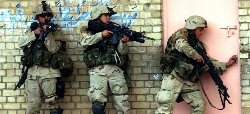U.S. soldiers clear a building during fighting in Fallujah, Iraq, in November 2004.