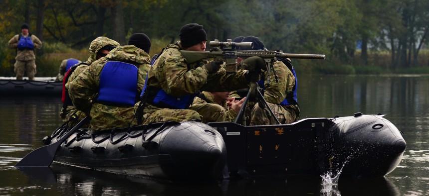 A U.S. soldier fires at a target from a Zodiac boat at the 7th Army Training Command's Grafenwoehr Training Area in Germany in 2016.