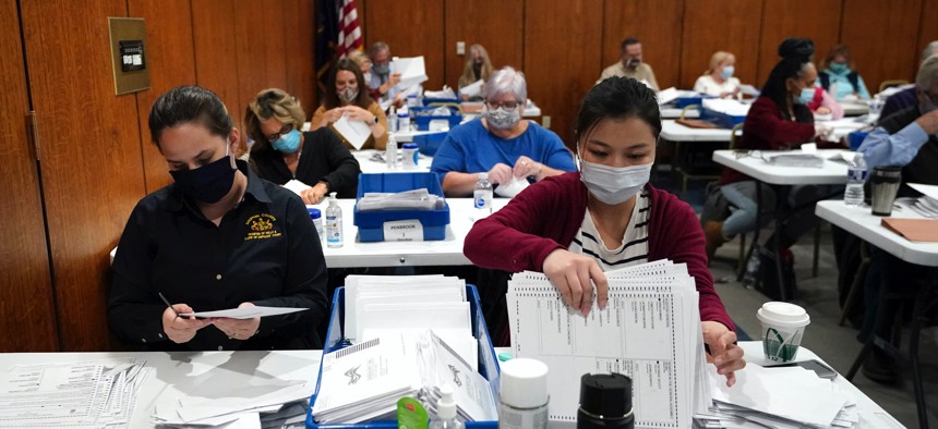 Election workers sort ballots at the Dauphin County Administration Building in Harrisburg, Pennsylvania, on Nov. 3, 2020.