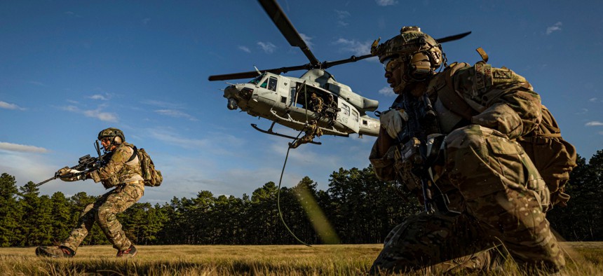 Special warfare airmen assigned to the New Jersey Air National Guard participate in fast-rope training with a Marine Corps UH-1Y Venom helicopter at Joint Base McGuire-Dix-Lakehurst, N.J., Oct. 10, 2019.