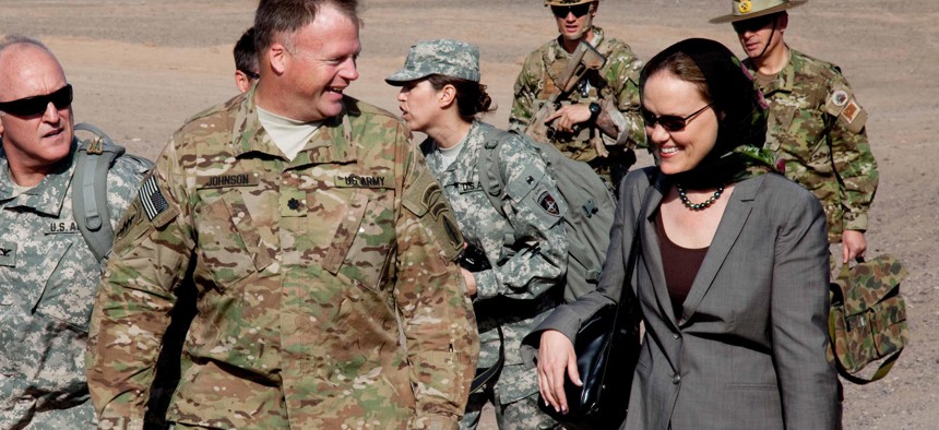 Lt. Col. Steven Johnson, Special Operations Task Force-West, commander greets Michele Flournoy, Undersecretary of Defense for Policy, upon arrival at a firebase in Shindand District, Afghanistan, April 13, 2011.