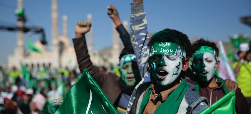 Supporters of Shiite rebels, known as Houthis, chant slogans as they attend a celebration of moulid al-nabi, the birth of Islam's prophet Muhammad in Sanaa, Yemen, Thursday, Oct. 29, 2020.