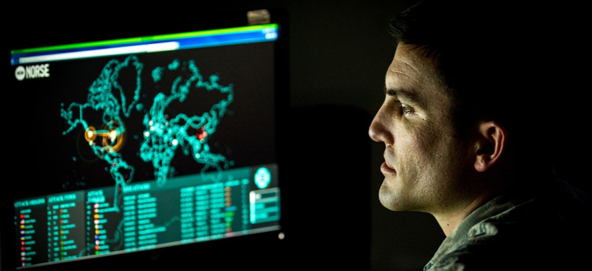 An Airman monitors live cyber attacks on the operations floor of the 27th Cyberspace Squadron, known as the Hunter's Den, at Warfield Air National Guard Base, Middle River, Md., June 3, 2017. 
