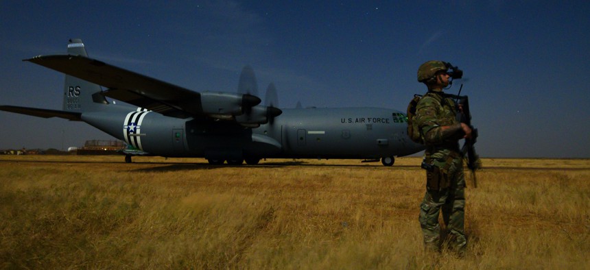 Army Spc. Christopher Andres, an Oregon National Guardsman assigned to the 41st Infantry Brigade Combat Team, provides security for an Air Force C-130J Super Hercules during unloading and loading operations in Somalia, Feb. 6, 2020.