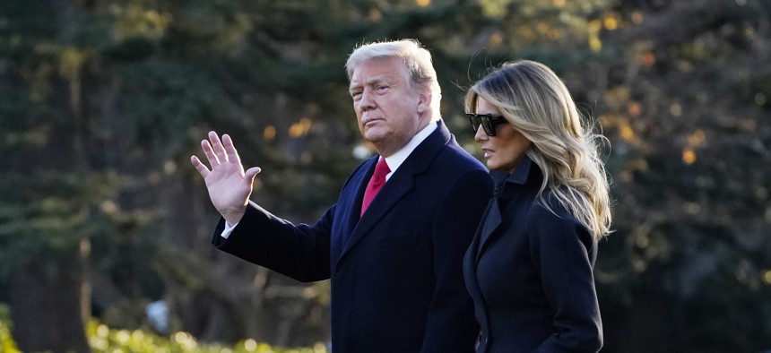 President Donald Trump and first lady Melania Trump walk to board Marine One on the South Lawn of the White House, Wednesday, Dec. 23, 2020, in Washington.