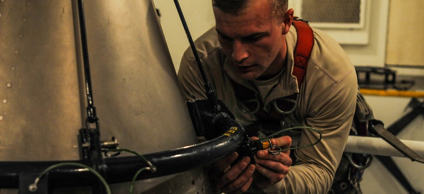 Senior Airman Andrew Parrish, 90th Missile Maintenance Squadron topside technician, performs maintenance on the forward section of a reentry system, Feb. 2, 2018, in the F. E. Warren Air Force Base missile complex. 