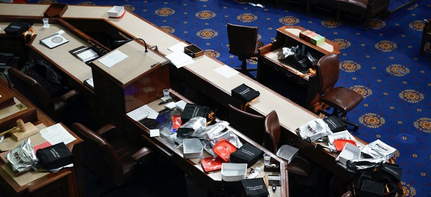 Papers and other equipment after the House floor was evacuate as protesters tried to break into the House Chamber at the U.S. Capitol on Wednesday, Jan. 6, 2021, in Washington. 