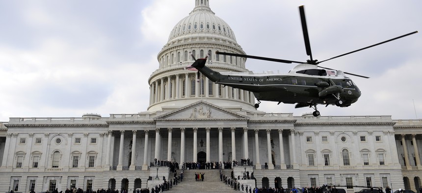 Former President George W. Bush departs on a Marine helicopter from the U.S. Capitol as President Barack Obama, first lady Michelle Obama, Vice President Joe Biden and his wife wave goodbye.