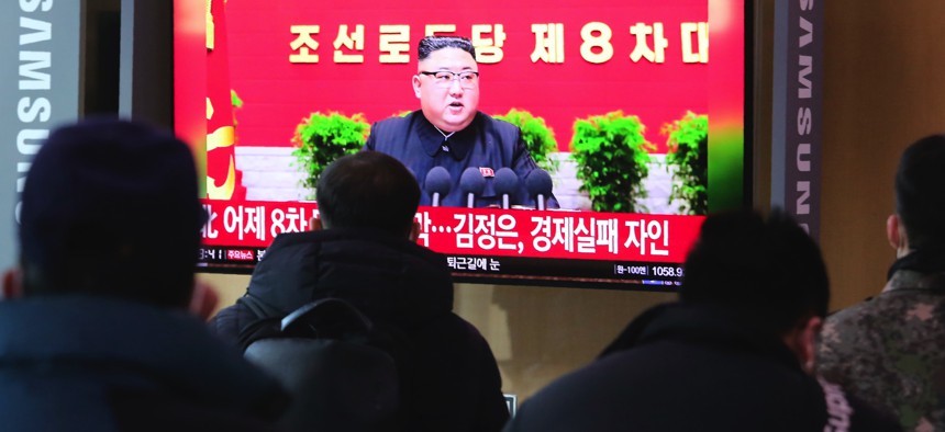 People watch a TV screen showing North Korean leader Kim Jong Un during a ruling party congress, at the Seoul Railway Station in Seoul, South Korea, Wednesday, Jan. 6, 2021.