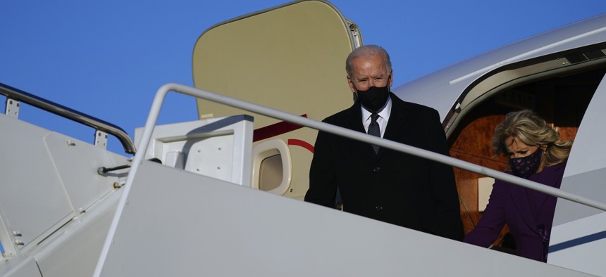 President-elect Joe Biden and his wife Jill Biden arrive at Andrews Air Force Base, Tuesday, Jan. 19, 2021, in Andrews Air Force Base, Md