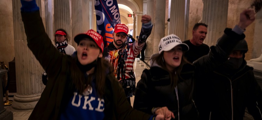 Pro-Trump rioters walk in the U.S. Capitol on Jan. 6.