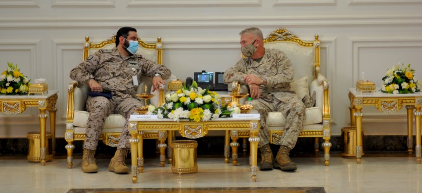 U.S. Marine Corps Gen Frank McKenzie, CDR, U.S. Central Command sits with Saudi Arabian Maj. Gen. Khalid bin Abdullah AlShablan, commander, Prince Sultan Air Base, during a visit to Prince Sultan Air Base, Kingdom of Saudi Arabia, July 9, 2020. 