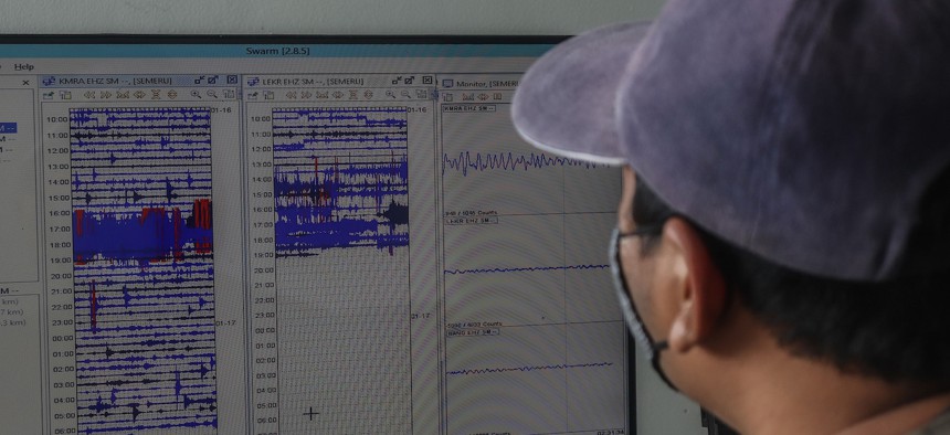 LUMAJANG, INDONESIA, JANUARY 17: An official monitors the seismograph used to monitor the eruption of Mount Semeru in Lumajang, East Java Province, on January 17, 2021. Mount Semeru erupted on January 16, 2021