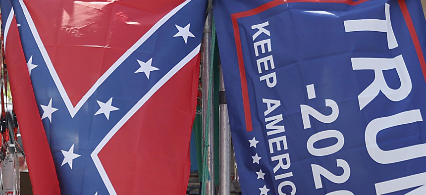 A vendor displays a confederate and Trump 2020 "Make America Great Again!" flag outside of the Bristol Motor Speedway prior to the NASCAR Cup Series All-Star Race at Bristol Motor Speedway on July 15, 2020.