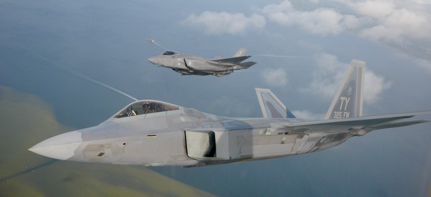 A F-22 Raptor from the 325th Fighter Wing flies alongside a F-35 Lightning II from the 33rd Fighter Wing over Florida.