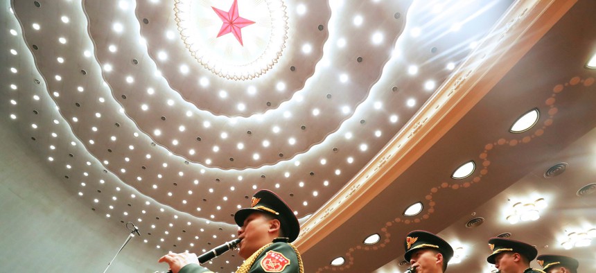 The military band of the Chinese People's Liberation Army performs during the opening meeting of the fourth session of the 13th National People's Congress NPC at the Great Hall of the People in Beijing, capital of China, March 5, 2021.