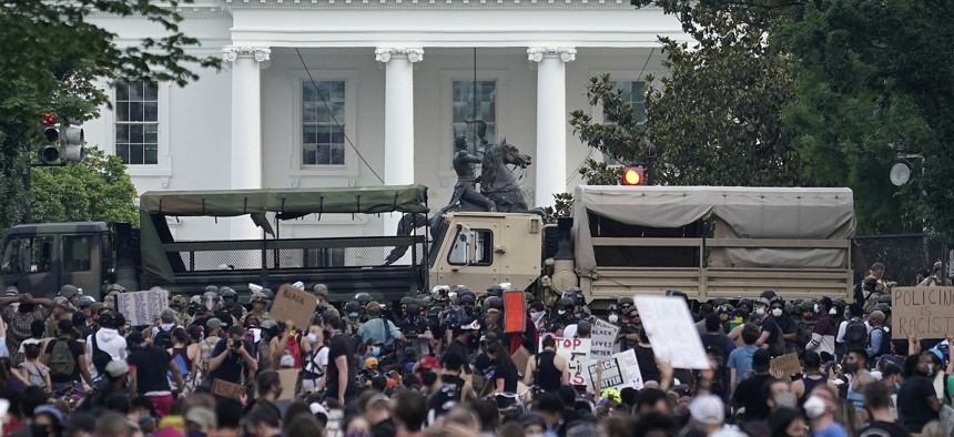 D.C. National Guard vehicles are used to block 16th Street near Lafayette Park and the White House as Demonstrators participate in a peaceful protest against police brutality and the death of George Floyd, on June 3, 2020 in Washington, DC.