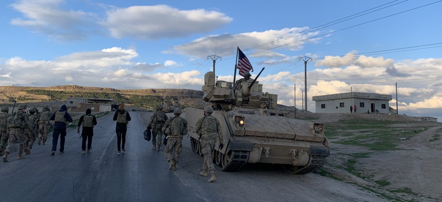 Members of the Louisiana National Guard’s 256th Infantry Brigade Combat Team on a presence patrol in far northeastern Syria. 