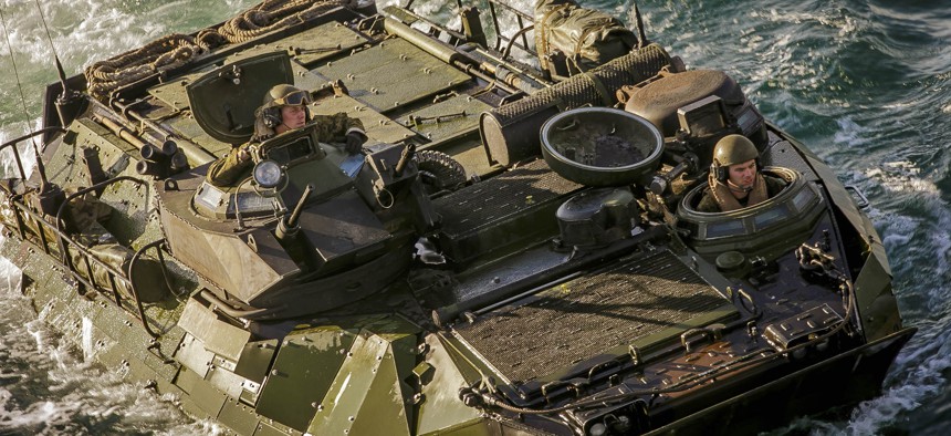 U.S. Marines with the 26th Marine Expeditionary Unit drive a AAV-P7/A1 assault amphibious vehicle into the dock landing ship USS Oak Hill near Onslow Beach, N.C., in November 2017.