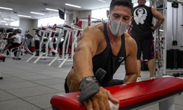 Marine Cpl. Avery Luengo wipes downs gym on Camp Foster, in Okinawa, Japan, July 29, 2020. 