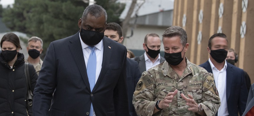 Defense Secretary Lloyd Austin walks with the Army Gen. Scott Miller at Resolute Support Headquarters, Kabul, Afghanistan, March 21, 2021.