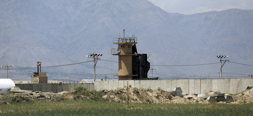 A wall surrounds Bagram Air Base in Afghanistan, May 3, 2021. As U.S. troops pack up to leave Afghanistan, the Americans are dismantling their portion of Bagram, their largest remaining outpost in Afghanistan. 