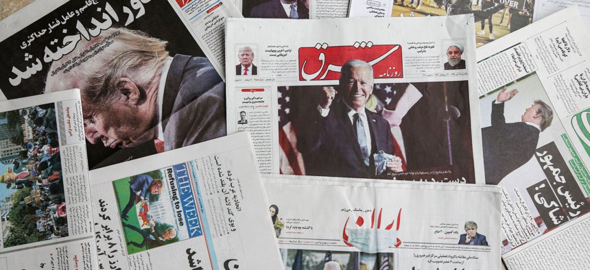 Iranian Farsi newspapers with headlines featuring the 2020 US general election results. 