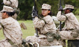 Female Marine Corps recruits wait for a turn to shoot on the rifle range at the United States Marine Corps recruit depot June 21, 2004.