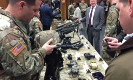 Army Capt. Josh Redmond of Program Executive Office Soldier shows off the new enhanced binocular night-vision goggles helmet during a demonstration at Fort Belvoir, Va., April 17, 2018.