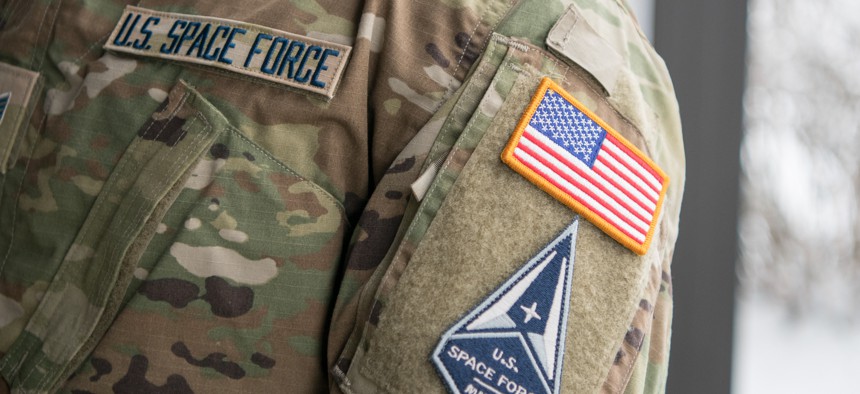 Staff Sgt. David Diehl II, 436th Communications Squadron noncommissioned officer in charge of wing cybersecurity, displays his new United States Space Force tapes and service branch patch at Dover Air Force Base, Delaware, Feb. 12, 2021.