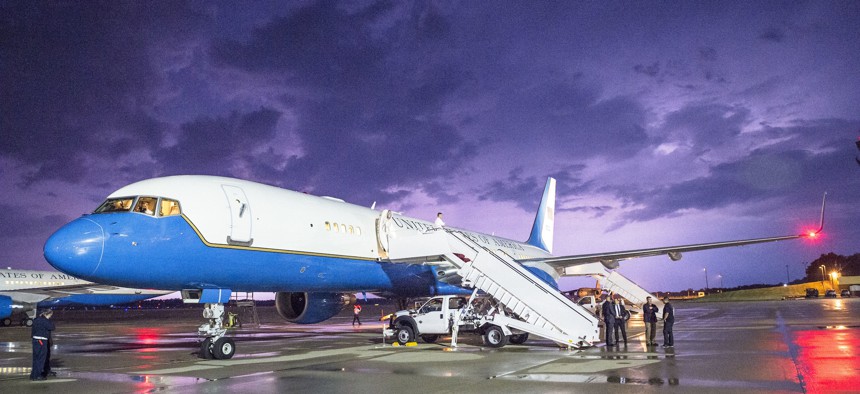 Lightning illuminates the sky behind a military C-32A (Boeing 757) parked on Joint Base Andrews, Md., May 18, 2015.