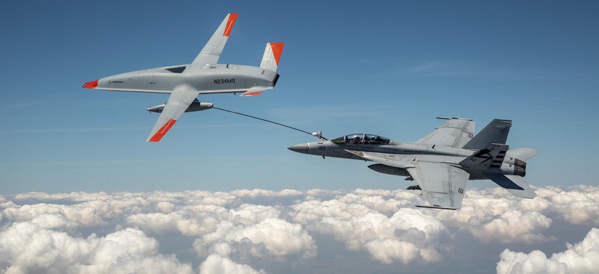 The Boeing MQ-25 T1 sends fuel to a U.S. Navy F/A-18 Super Hornet during a June 4 test flight, the first time an unmanned aircraft has refueled another aircraft.