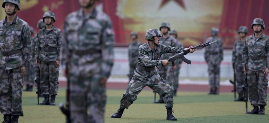 Chinese People's Liberation Army cadets drill at the Armoured Forces Engineering Academy Base in 2014. 